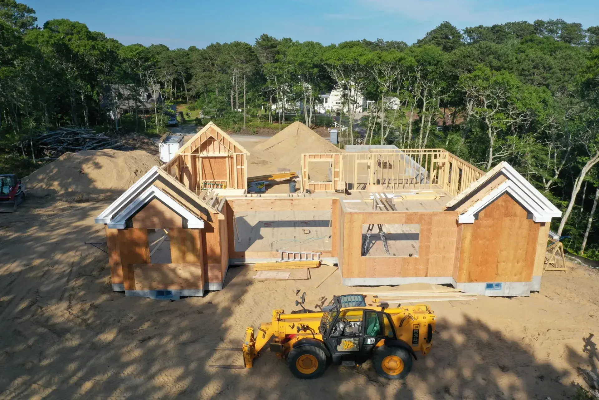 Aerial view of a custom home framing project on Cape Cod by Tuleika Building Company